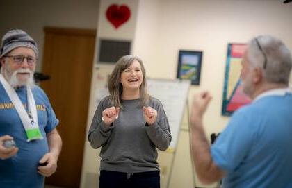 Kristen Frechette, RN, works with two patients